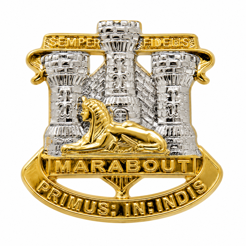 Devon and Dorset Regiment 25mm bi-metal lapel pin featuring a silver castle with three towers, a gold sphinx, the battle honour "Marabout", the motto "Primus In Indis", and the scroll "Semper Fidelis", displayed on a white background.