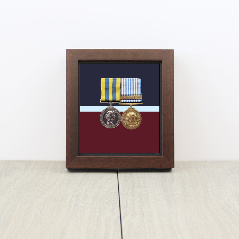 RAF Medal Display Case with single mounted medal and RAF belt background