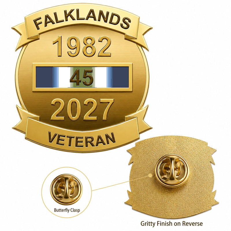 Gold commemorative pin badge reading 'FALKLANDS 1982 2027 VETERAN' with a ribbon bar showing 45 years service, plus inset views of the butterfly clasp and textured reverse side on a white background.