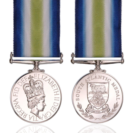 Front and back views of a South Atlantic Medal with a blue, white, and green striped ribbon, displayed on a clean white background with a subtle reflection.